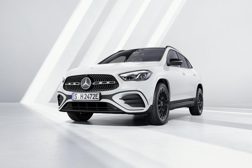 A white Mercedes-Benz GLA in a bright studio with diagonal beams of light